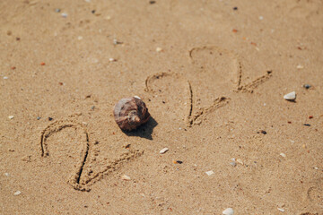 Word 2022 Written on the Sand of a Beach. New Year 2022 text on the sea beach