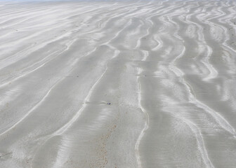 Patterns in the sand at the low tide