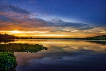 Foto op Canvas zonsondergang over het meer © David Arment