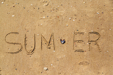 Word Summer Written on the Sand of a Beach. Text on the Sea Beach
