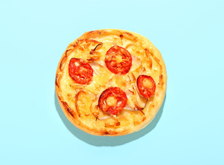 Tasty homemade mini pizza on color background