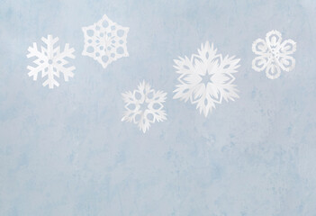 Different Christmas snowflakes on light background