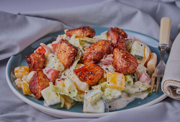 Honey glazed chicken with salad and yogurt dressing.