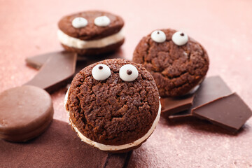 Funny chocolate cookies on color background