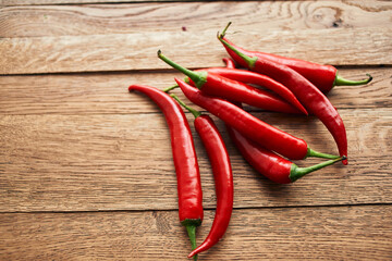 red hot chili peppers on a wooden board kitchen ingredients