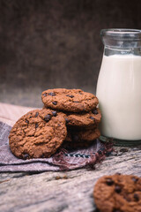 a portrait of chocolate cookies and milk