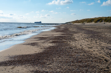 View on white sandy  beach, dunes and water of North sea between Vlissingen en Domburg, Zeeland, Netherlands