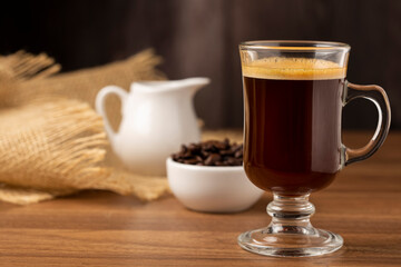 Espresso and coffee beans on the table.