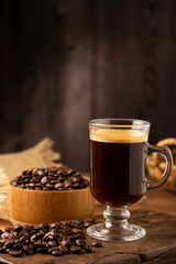 Espresso and coffee beans on the table.