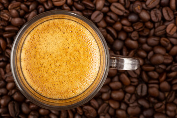 Espresso and coffee beans on the table.