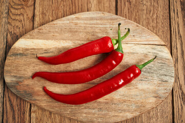 red hot chili peppers on a wooden board kitchen ingredients