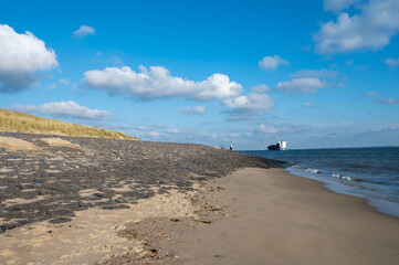 View on white sandy  beach, dunes and water of North sea between Vlissingen en Domburg, Zeeland, Netherlands