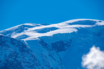 View from Saint-Gervais-les-Bains to white top of Mont Blanc mountaine range in summer