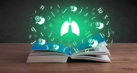 Open medical book with health icons above