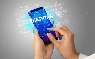 Hand using smartphone with social media concept concept