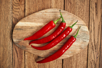 red hot chili peppers on a wooden board kitchen ingredients