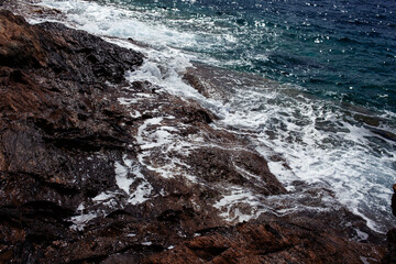 Beautiful wild landscape: seashore with rocks and clear water