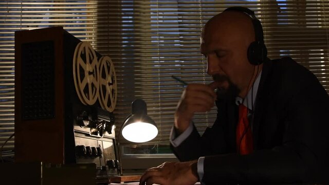 KGB secret agent eavesdrops on headphones
