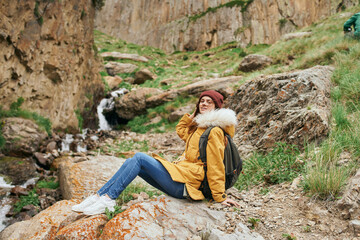 Naklejka premium woman hiker with backpack mountains travel adventure freedom