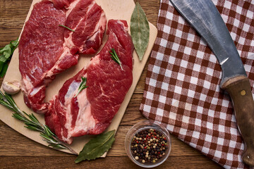 meat on a wooden table pepper ingredients cooking protein