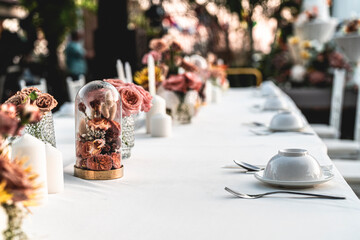 beautiful decorated dining table for outdoor wedding ceremony