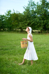 Obraz premium Woman in white dress in the village outdoors Green grass Farmer