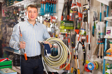 Obraz premium Portrait of male in hardware store buying goods