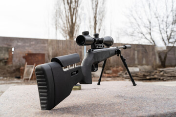 Black polymer frame modern Air gun with optics on the table outdoor