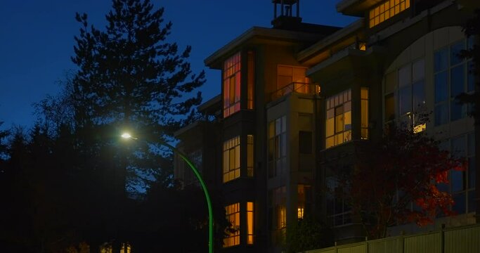 Establishing shot of modern apartment building with stairs and beautiful landscape in Vancouver, Canada, North America. Night time on Oct 2021. Still camera view. ProRes 422 HQ.