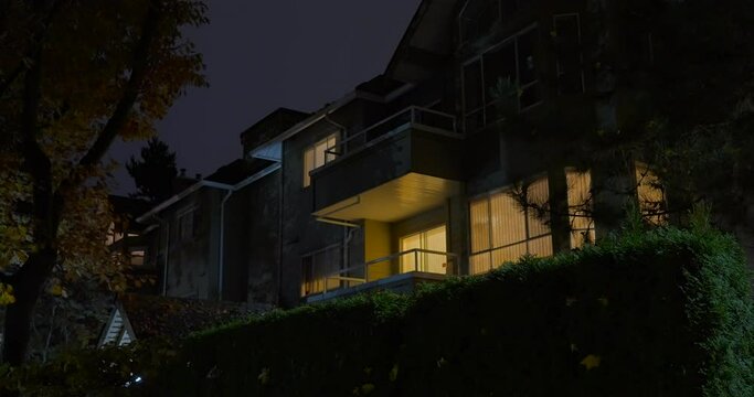 Establishing shot of modern apartment building with stairs and beautiful landscape in Vancouver, Canada, North America. Night time on Oct 2021. Still camera view. ProRes 422 HQ.
