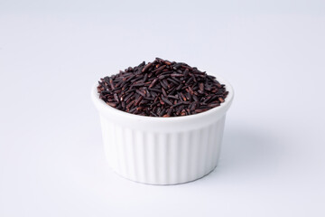 riceberry rice in a white bowl on white background