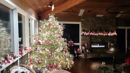 Decorated Christmas Tree in a Cozy Log Cabin Room in the Evening