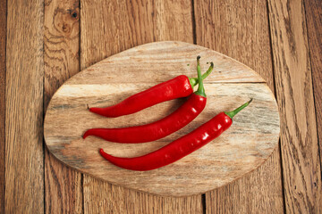 red hot chili peppers on a wooden board kitchen ingredients