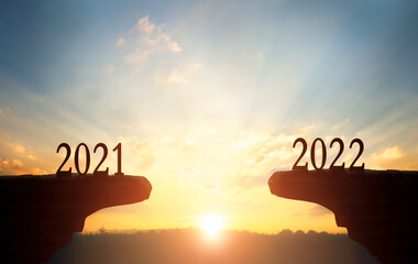 2022 concept:2022 on the mountain at sunset background
