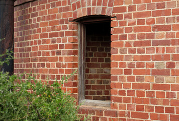 red brick wall and window