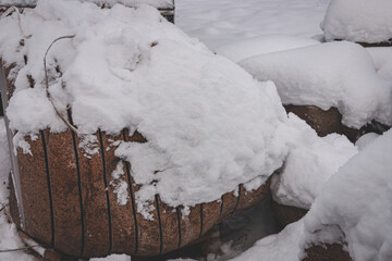 big granite boulders cutted in slabs under snow. Exclusive and expensive building and finishing...