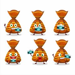 Photographer profession emoticon with orange candy wrappers cartoon character