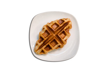 Croffle is a combination of croissant and waffle. This croffle served on a white plate 