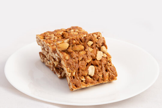 Peanut Candy Bars Mithai Or Giurgiulena Known As Meetha Chikki, Gud Patti, Gur Mungfali Chiki, Gajak, Tilgul, Gajjak, Gazak Or Gachak Is Made Of Moongfali And Jaggery. Makar Sankranti And Lohri Food