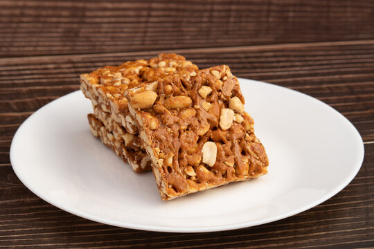 Peanut Candy Bars Mithai Or Giurgiulena Known As Meetha Chikki, Gud Patti, Gur Mungfali Chiki, Gajak, Tilgul, Gajjak, Gazak Or Gachak Is Made Of Moongfali And Jaggery. Makar Sankranti And Lohri Food