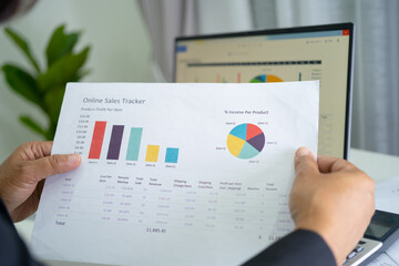 Fototapeta premium Asian accountant working and analyzing financial reports project accounting with chart graph in modern office, finance and business concept.