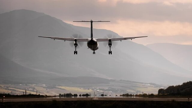 Propellor Airplane Landing On Runway