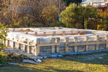 Fototapeta na wymiar The foundation of a country house under construction.