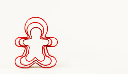 Obraz premium Gingerbread man shape on white background. Concept of Christmas.