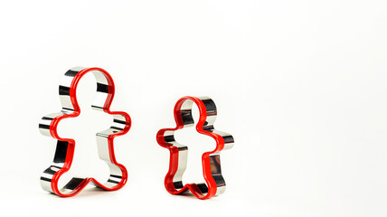 Gingerbread man shape on white background. Concept of Christmas.