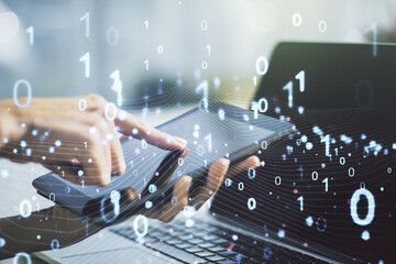 Creative abstract binary code hologram and finger presses on a digital tablet on background, AI and machine learning concept. Multiexposure