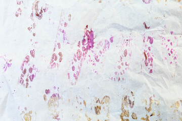 Abstract purple food stain on white bake paper background, abstract paper texture background