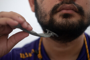 Half face of Asian handsome men are shave and beard.