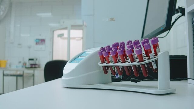 Centrifuge in research chemical laboratory, mixer with blood samples. Medical equipment for test and examination. Mixer with blood samples. High quality 4k footage