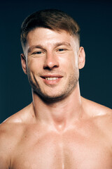 Fototapeta premium athletic male topless workout muscle bodybuilder dark background